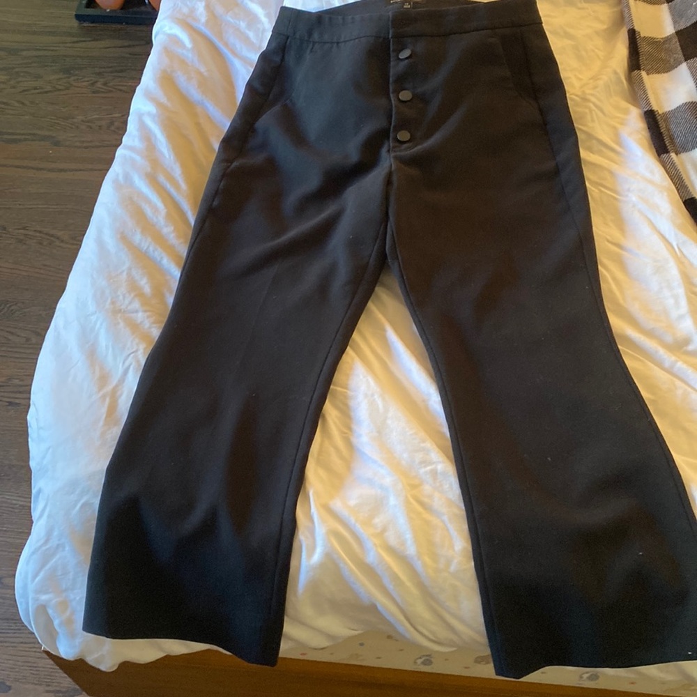 Cropped boot cut trousers.